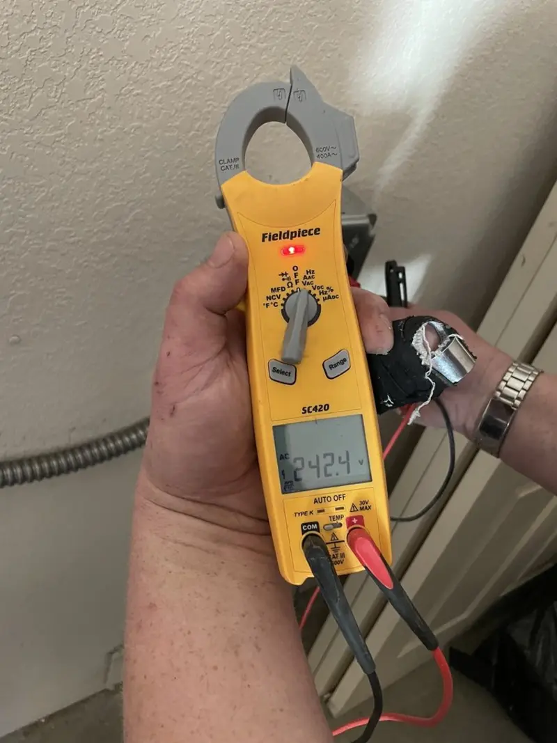 Voltage testing with clamp meter during Generator Installation in Oak Hills